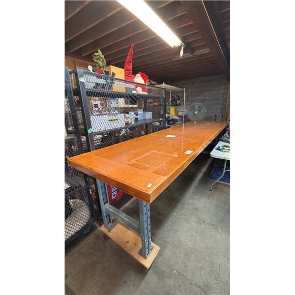 VERY LARGE MOBILE WOOD TABLE WITH METAL LEGS: APPROX 145.5"L X 37"D X 40"T