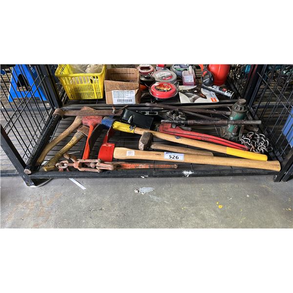 SHELF OF ASSORTED TOOLS INCLUDING; PICKAXE, BOTTLE JACK, PIPE WRENCH & MORE