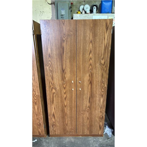 2 DOOR WOOD CABINET 29" X 15.5" X 60" (HANDLE BROKEN)
