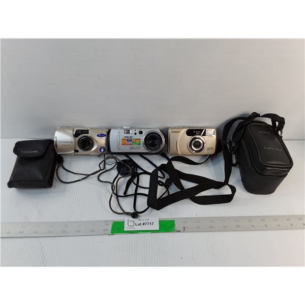 (3) Cameras- Samsung- Powers On, Sony & Olympus- As Is & (2) Cases