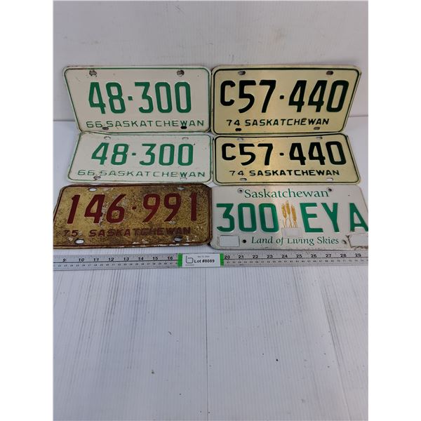 (2) Pairs of Saskatchewan License Plates and (2) Singles