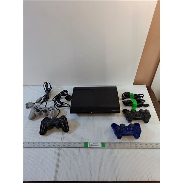 Video Games - PS3 (Powers On) (2) PS2 Controllers  (2) PS3 Controllers  (1) 6' HDMI Cable