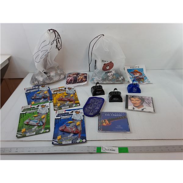 (4) Finger Skateboards- Sealed, (2) Puzzles- As Is, Rod Stewart & Eric Clapton CDs, Cowbells