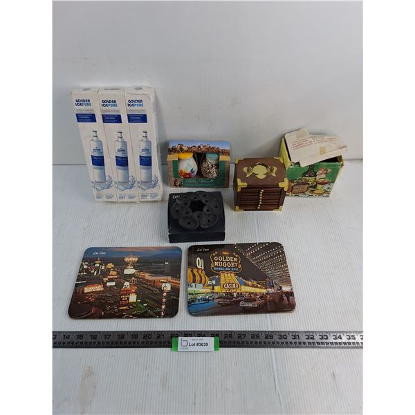 (3) NIB Water Filters, Ceramic Spice Shakers, Dansk Candle Wreath, Coaster Set, Vegas Hot Plate Sets