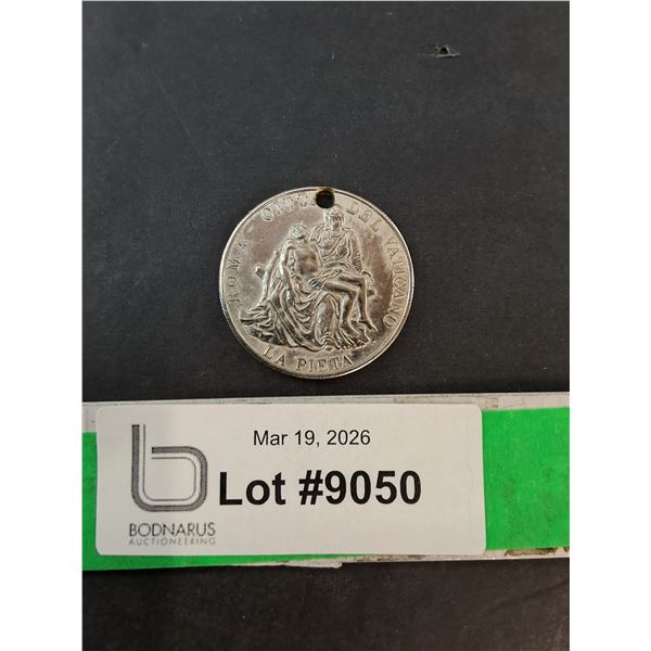 ^Silver Colored Medal Featuring Michelangelo's 'La Pieta'