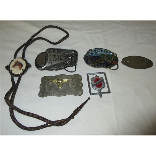 (R #1):  BUNDLE OF BELT BUCKLES, BOLO TIE & OLDSMOBILE HOOD ORNAMENT