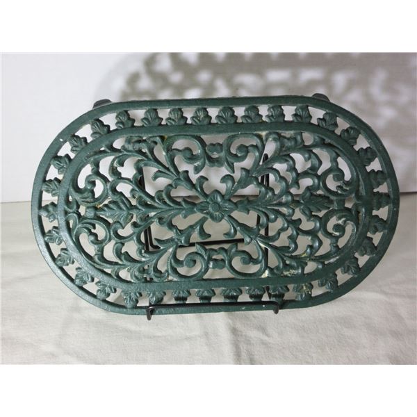 (R #1):  CAST IRON OVAL TRIVET (APPROX. 10" L)