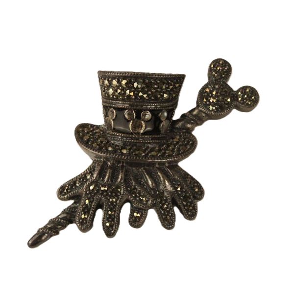 A Pewter Colored Top Hat, Gloves And Cane Pin.