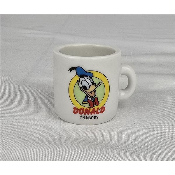 A Miniature Donald Duck Coffee Mug.