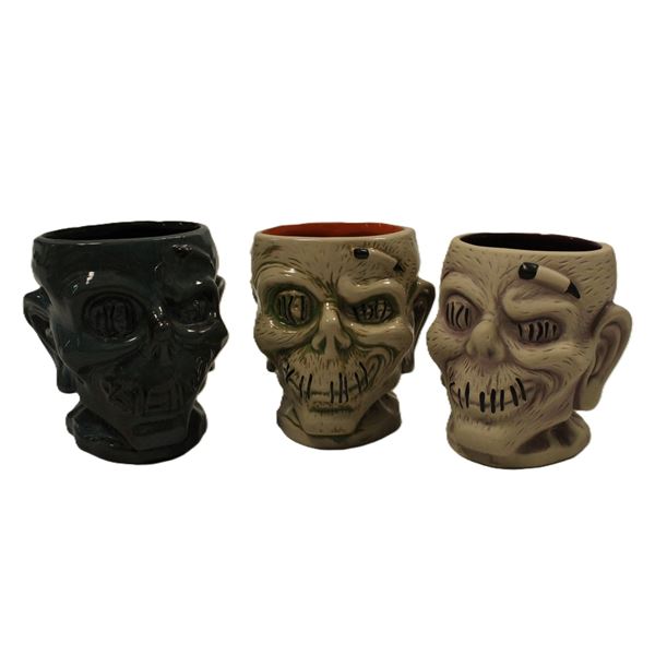 A Trio of Trader Sam's Enchanted Tiki Bar Zombie Mugs.