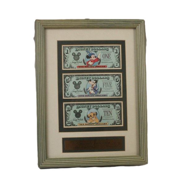 A Framed Matched Set of 25th Anniversary Disney Dollars.