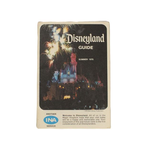 A pair of Disneyland Guidebooks.