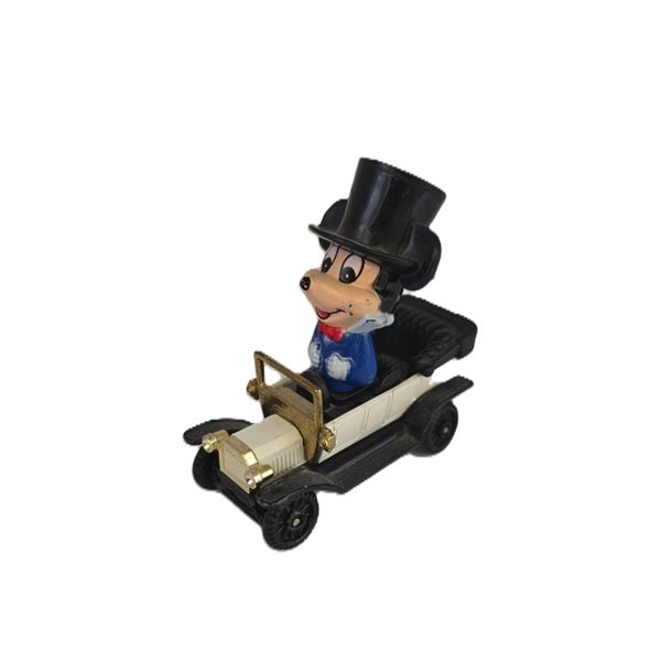 A Vintage Mickey Mouse Character In A Toy Car.