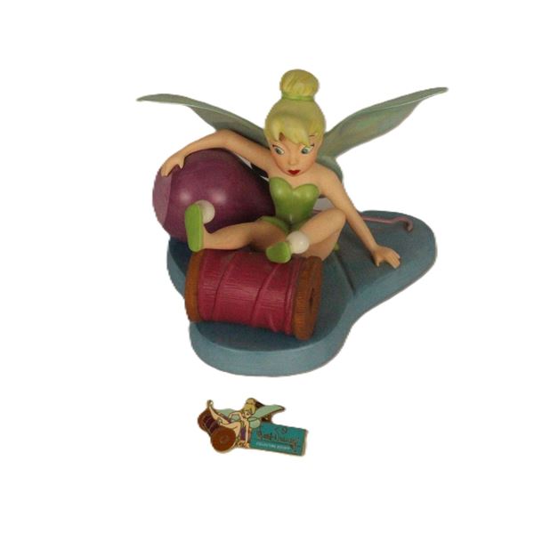A WDCC Tinkerbell Figurine And Matching Pin.