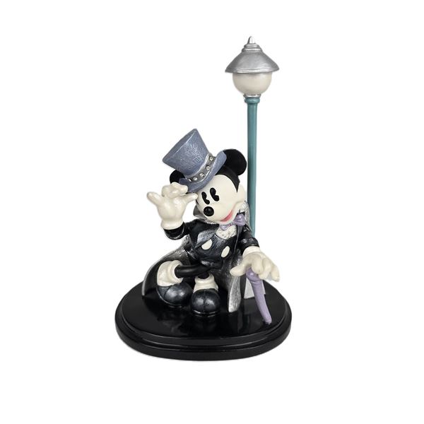 A Mickey Mouse “Steppin Out” Figurine.