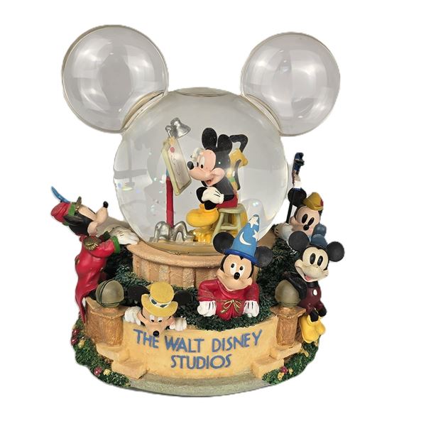 A Large Musical Walt Disney Studios Snow Globe.
