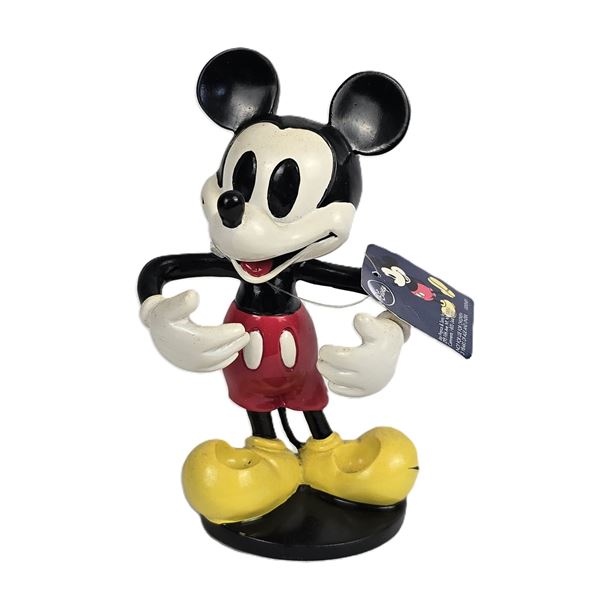 A Mickey Mouse Resin Toothbrush Holder.