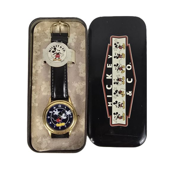 A Gold-toned Mickey and Co Watch.