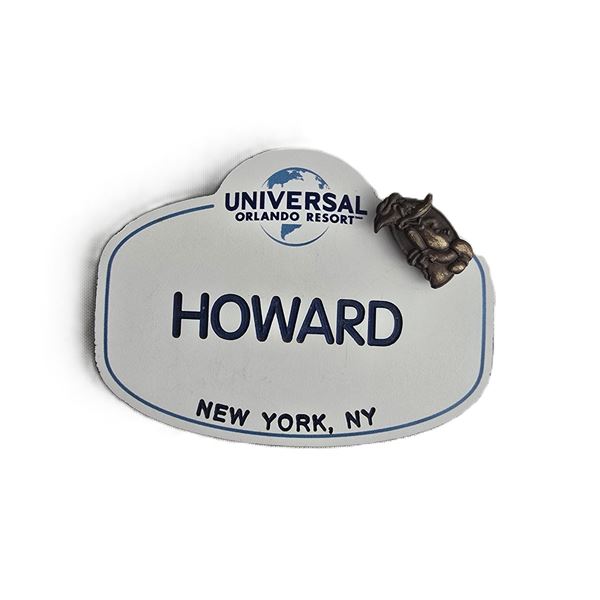 A Universal Studios Team Member Badge With Retired Woody Woodpecker 1 Year Anniversary Pin.