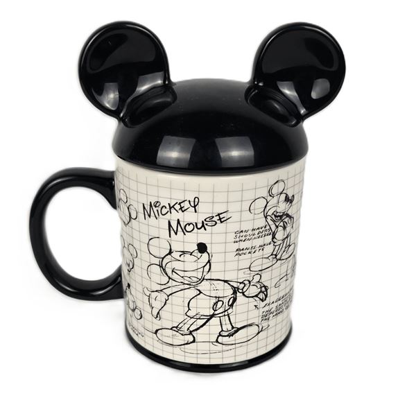 An Artist Drawing Mickey Mug and Lid.