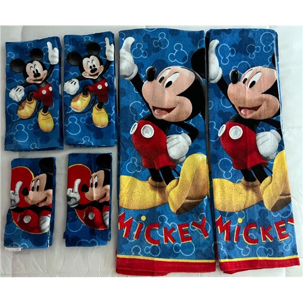A Mickey Mouse Shower Curtain and Matching Towel Set.