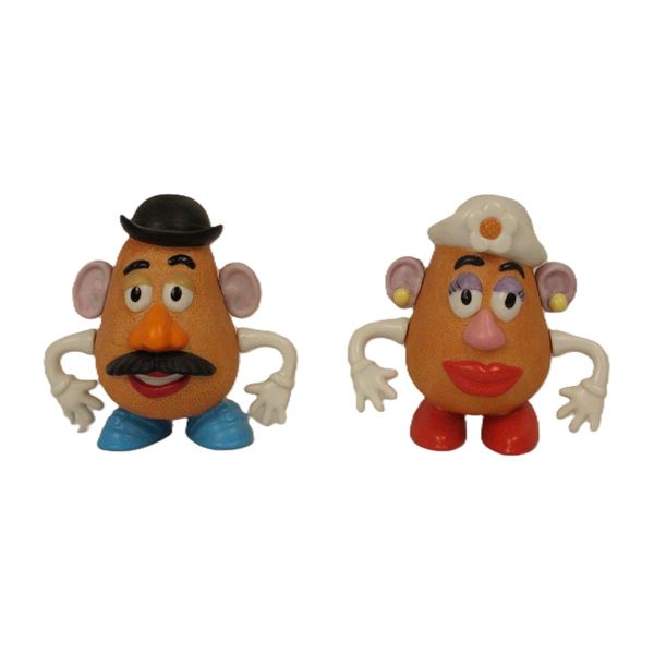 A 2-Piece Ceramic Mr. And Mrs. Potato Head Figurine Set.