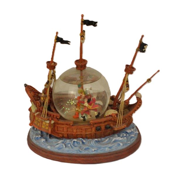 A Peter Pan The Jolly Roger Snow Globe.