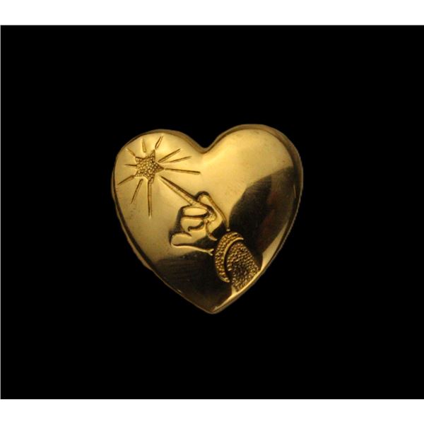 The Variety Club Gold Heart Pin.