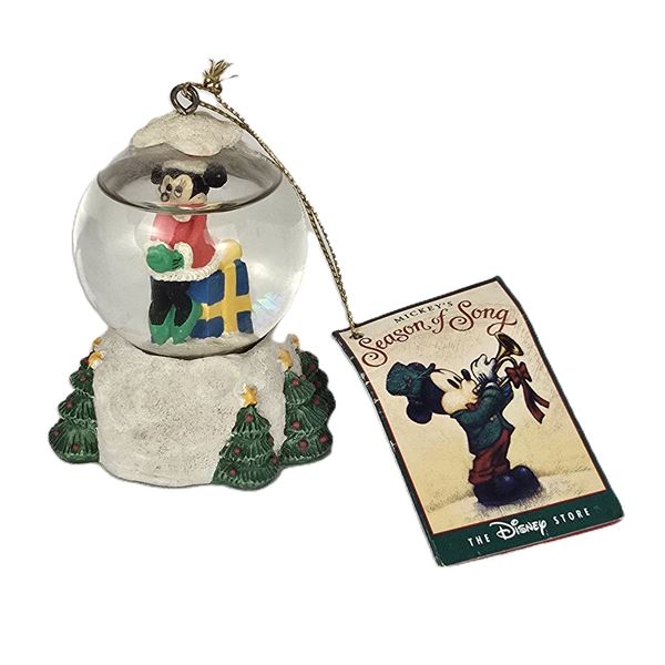 A Small Christmas Minnie Mouse Snow Globe Ornament.