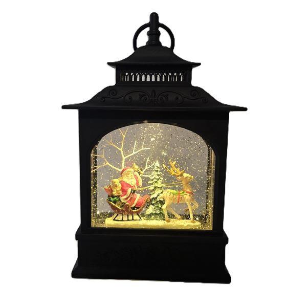 A Christmas Lantern Snowglobe featuring Old World Santa.