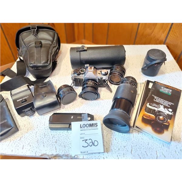 CANON AE-1 CAMERA WITH A COLLECTION OF EXTRAS