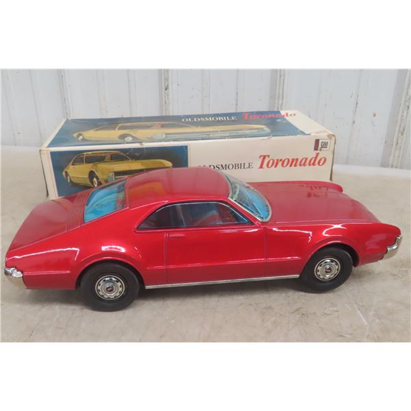 Asahi Toy Co. Friction Tin Oldsmobile Toronado, 1960s, 15 1/2"