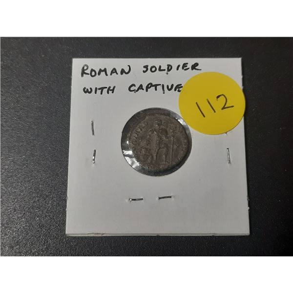 Ancient Roman coin. Unknown emperor. Reverse depicts Roman soldier with captive. VF.