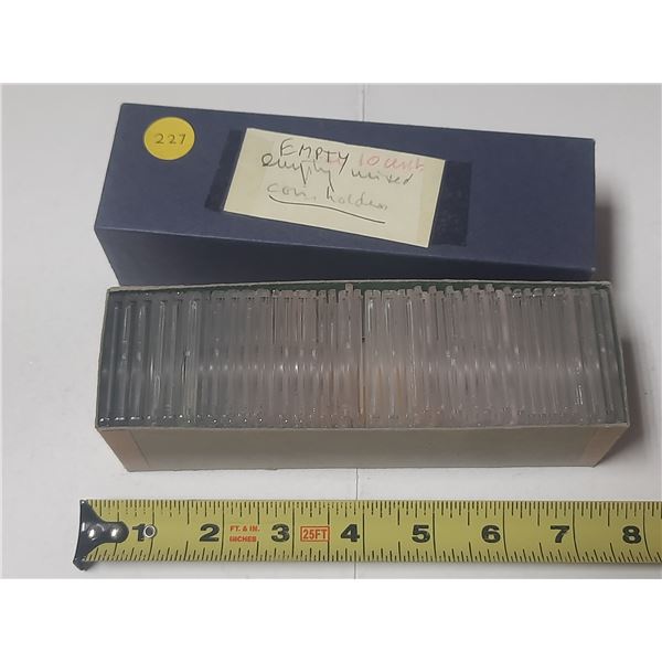 33 empty hard plastic holders for coins.