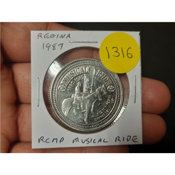 1987 Regina Trade Dollar. Commemorates the RCMP Musical Ride. Unc.