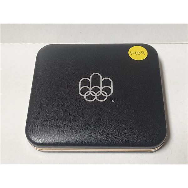 Empty 1976 Olympic Games case for housing $5 and $10 Montreal Olympic coins.