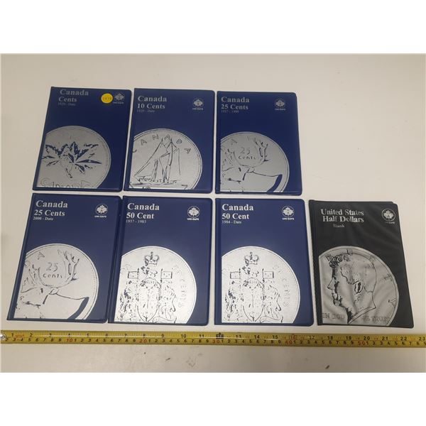 Seven Uni-safe coin folders- 1,10,2@25, 2@50 cents and one U.S.A. half dollar