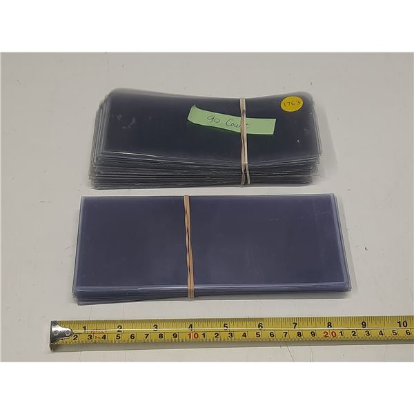 (90) Plastic Currency Sleeves.