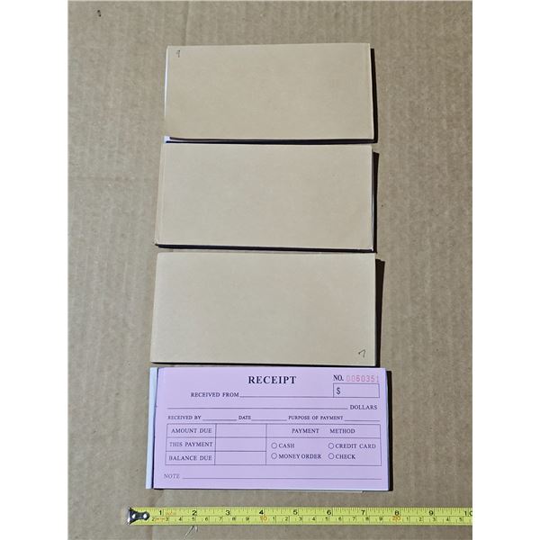 Four unused 50 page carbonless Receipt books