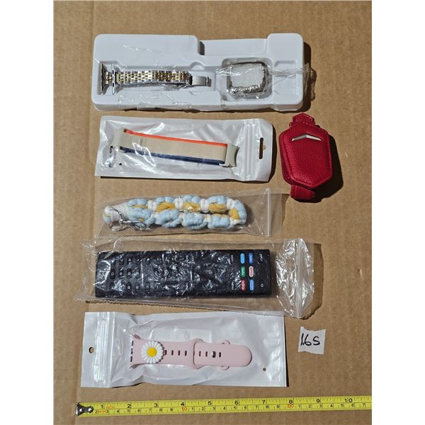 unused watch straps, key chain, money clip and universal remote