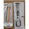 Image 2 : unused watch straps, key chain, money clip and universal remote
