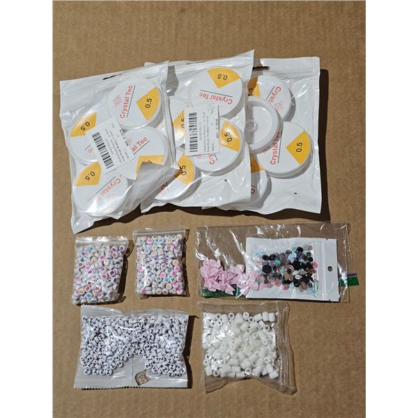 Bracelet making supplies.  Beads & rolls of elastic
