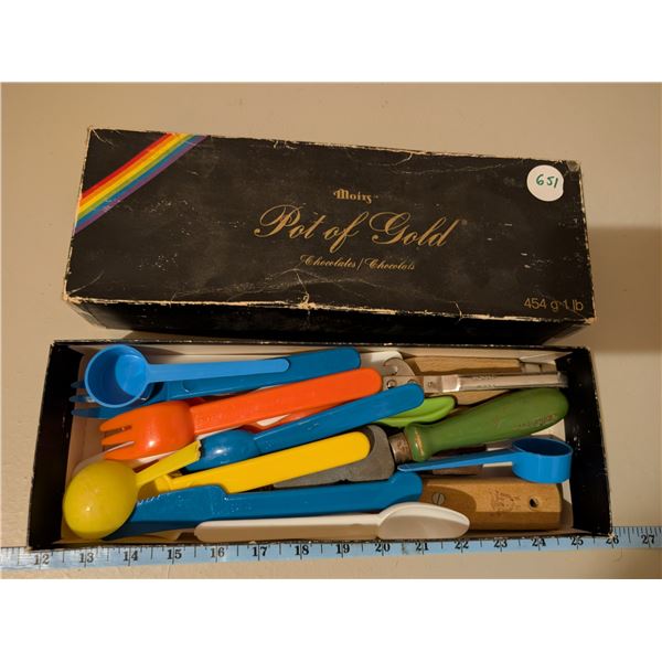 Vintage Pot of Gold box filled with plastic cutlery, knives, knife sharpener