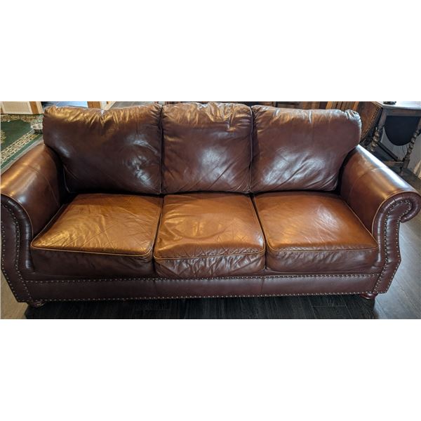 Brown Leather Couch with rivets - good condition - some wear on back leather cushion, middle seat is