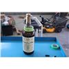 Image 1 : Empty Canadian Club whiskey bottle commonly used for storing change. The bottle features original la