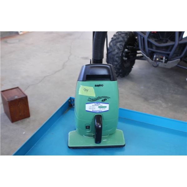 Sanyo Transformax 3-in-1 vacuum cleaner in green. Features a compact design with detachable hose and