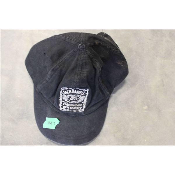 Black baseball-style cap featuring the Jack Daniel's Tennessee Whiskey logo on the front. 