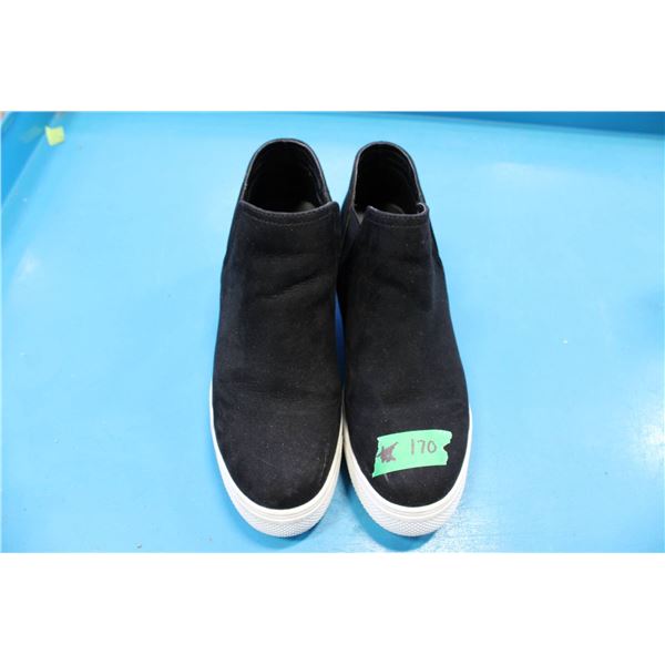 Steve Madden black slip-on sneakers featuring a suede-like finish and a white rubber sole