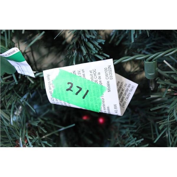 Artificial green Christmas tree featuring integrated pine cone embellishments and a metal stand. Des