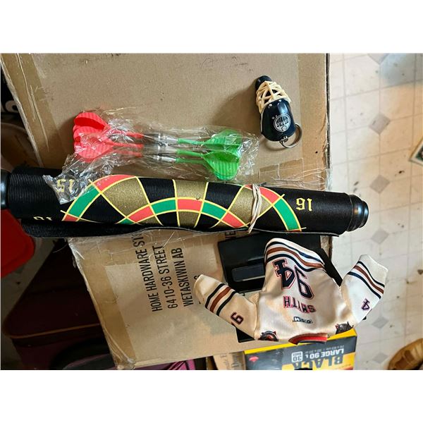 Misc Items Hockey Jersey on stand, Oilers Key ring, and hanging Dart board.